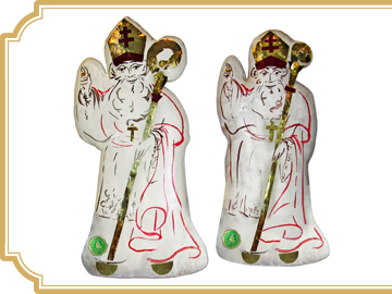 Nos saints Nicolas en pain d’épices au miel, recouverts de glace royale et peints à la main.